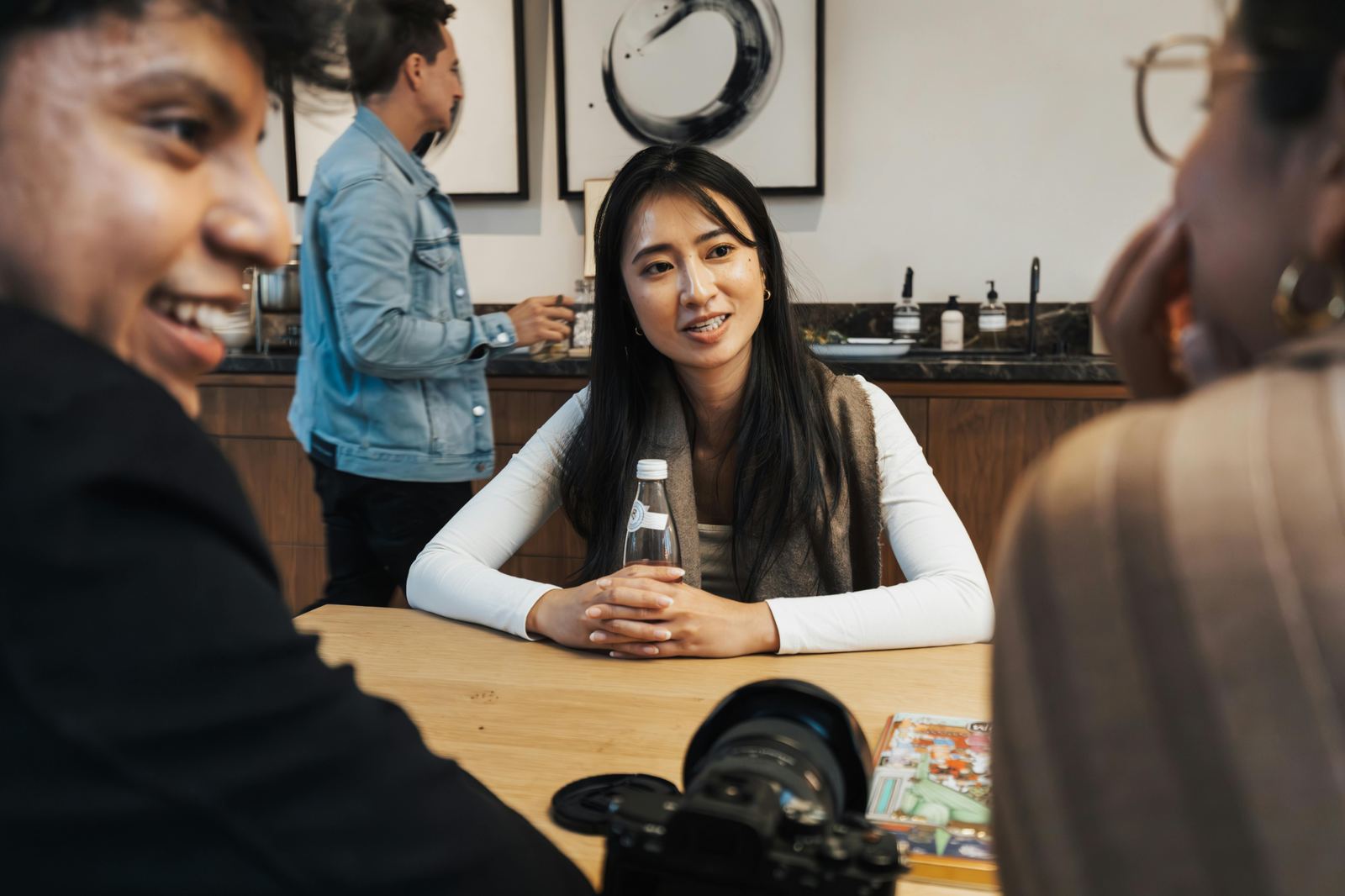 Young adults talking around a table