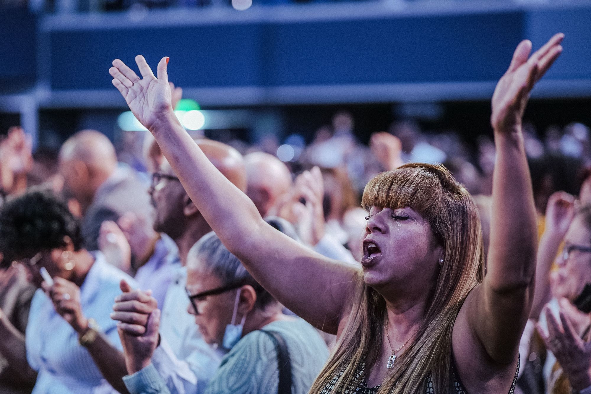 Worshippers raising their hands together