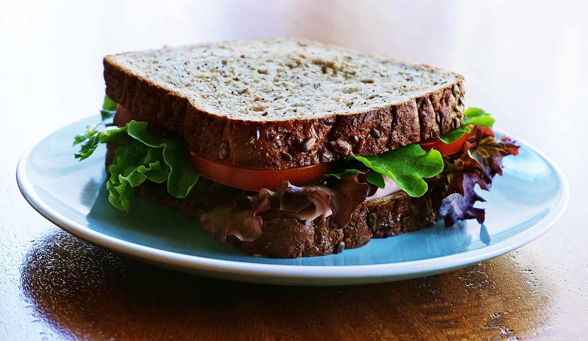 A freshly made sandwich filled with crisp vegetables